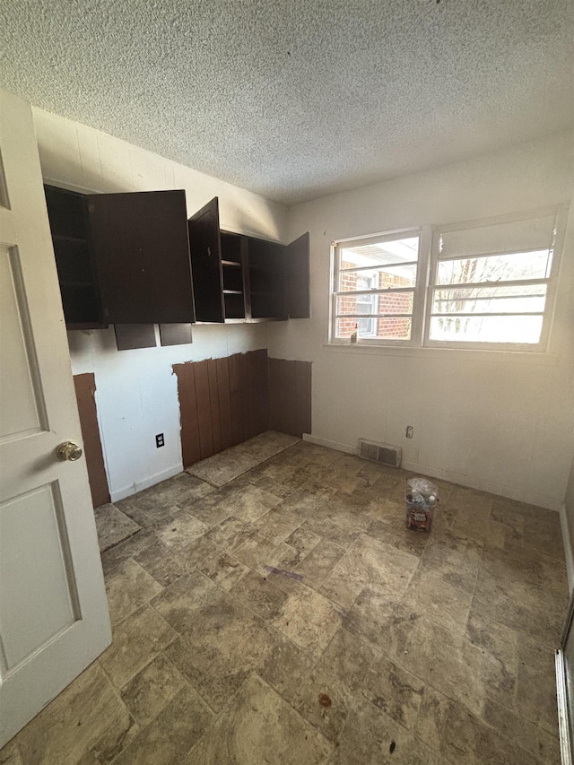 kitchen featuring a textured ceiling