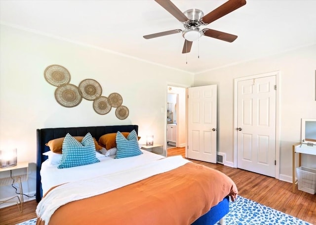 bedroom featuring hardwood / wood-style floors and ceiling fan