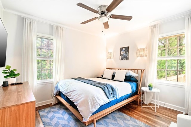 bedroom featuring hardwood / wood-style floors and ceiling fan