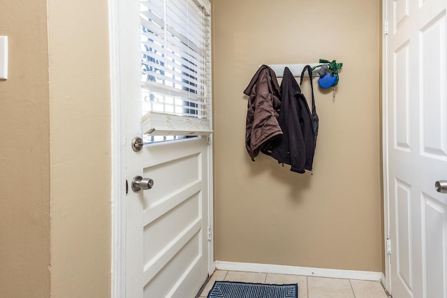 doorway to outside featuring light tile patterned floors