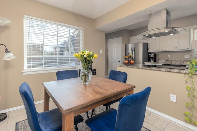 dining room with light tile patterned flooring