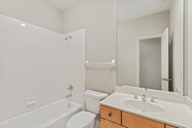 full bathroom featuring toilet, vanity, and bathing tub / shower combination