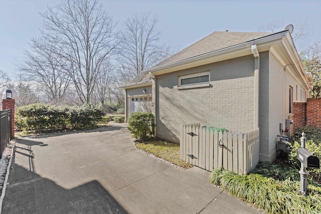 view of side of home with a garage