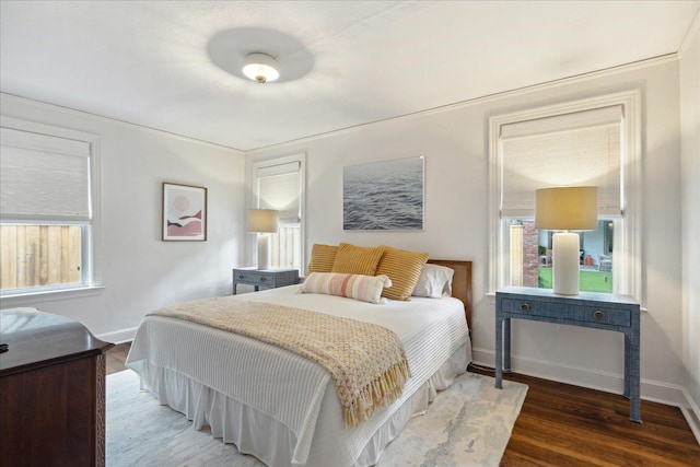 bedroom featuring dark hardwood / wood-style flooring