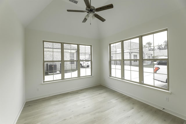 unfurnished room featuring lofted ceiling, ceiling fan, and light hardwood / wood-style floors