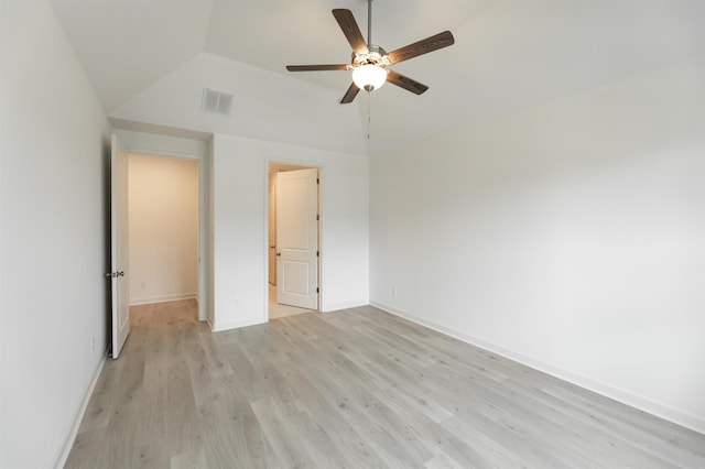 unfurnished bedroom featuring ceiling fan, light hardwood / wood-style floors, and lofted ceiling