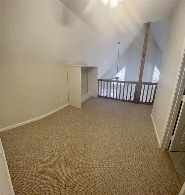 additional living space with vaulted ceiling, ceiling fan, and carpet