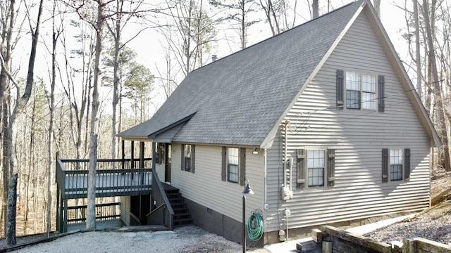 view of side of property with a deck