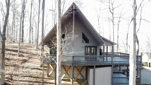 back of property featuring a wooden deck