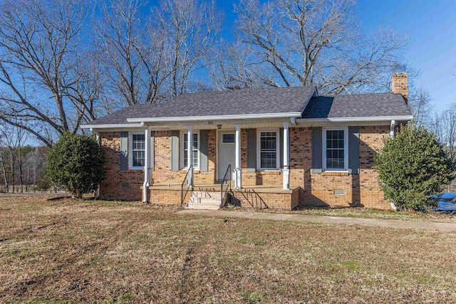 ranch-style home with covered porch and a front lawn