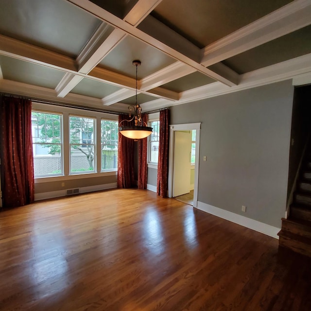 unfurnished living room with beam ceiling, ornamental molding, coffered ceiling, and hardwood / wood-style floors