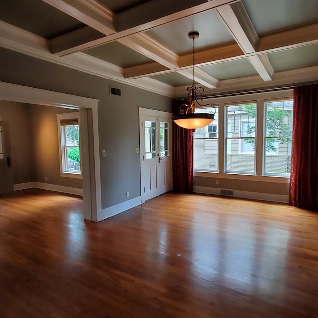 unfurnished dining area with coffered ceiling, beamed ceiling, hardwood / wood-style flooring, and crown molding