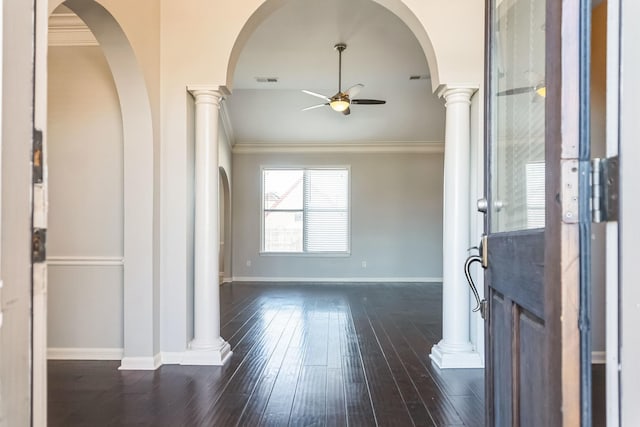 entrance foyer featuring dark wood-type flooring, ceiling fan, and crown molding