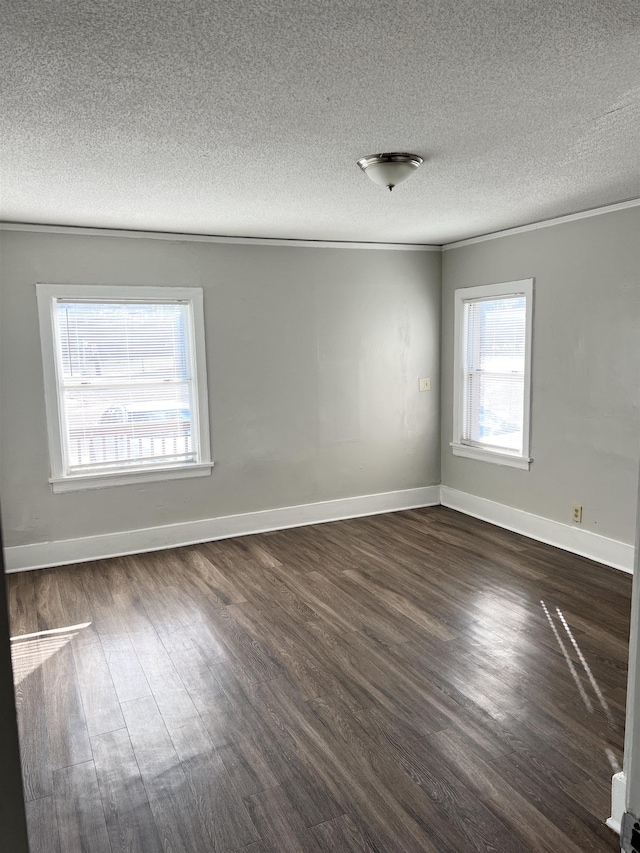 unfurnished room featuring a textured ceiling and dark hardwood / wood-style floors