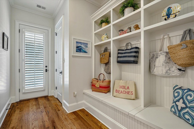 mudroom featuring dark hardwood / wood-style flooring and crown molding