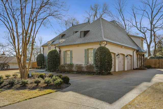 view of property exterior with a garage