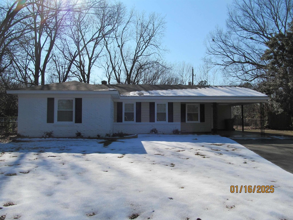 ranch-style house with a carport