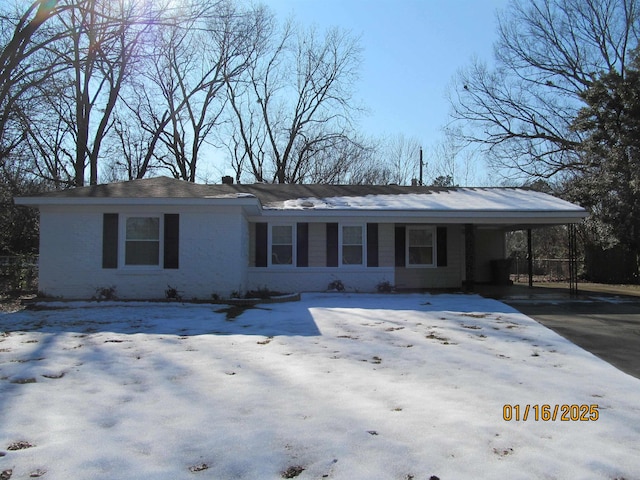 ranch-style house with a carport