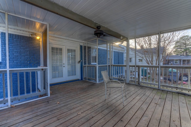 wooden terrace featuring ceiling fan and french doors