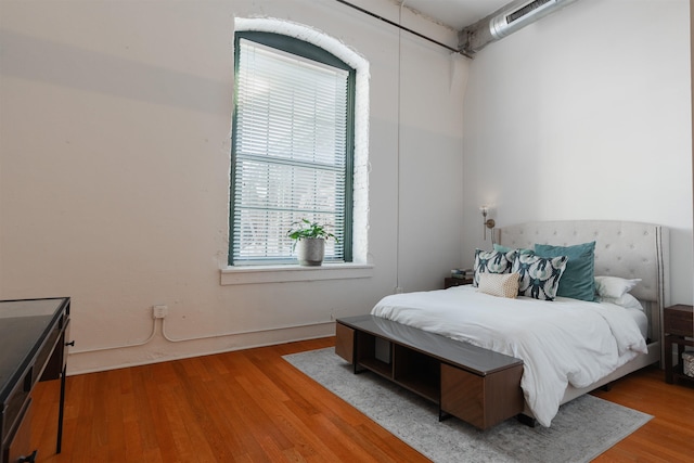 bedroom featuring wood-type flooring