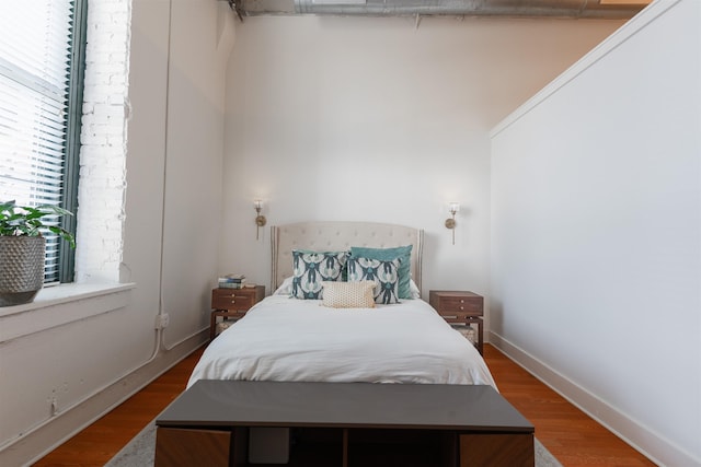 bedroom with hardwood / wood-style floors