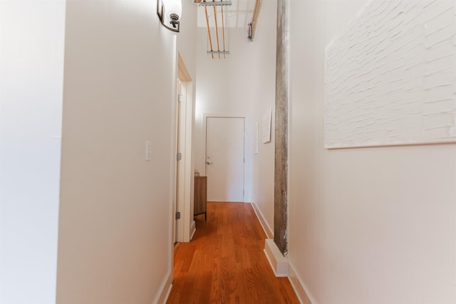 corridor featuring hardwood / wood-style floors