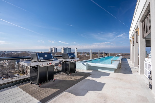 view of swimming pool featuring a grill