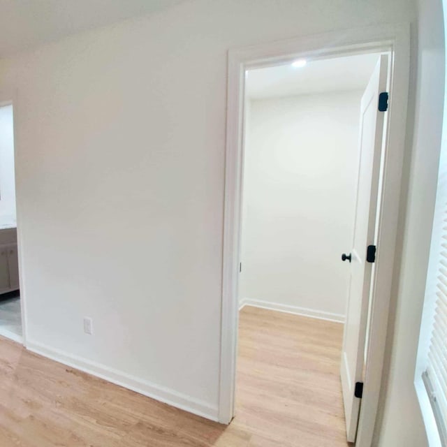 hall with light hardwood / wood-style floors