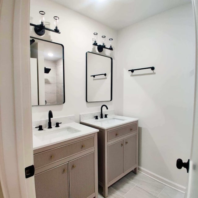 bathroom with tile patterned flooring and vanity