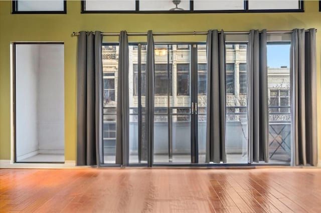 doorway to outside with wood-type flooring