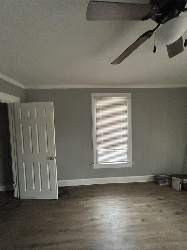 unfurnished bedroom featuring hardwood / wood-style floors, ceiling fan, and ornamental molding