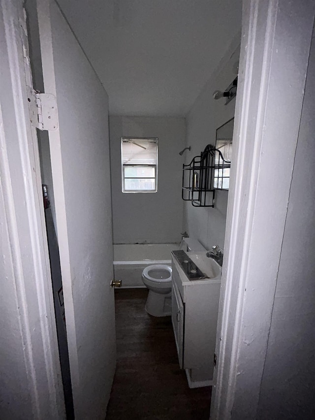 bathroom featuring toilet, wood-type flooring, and vanity