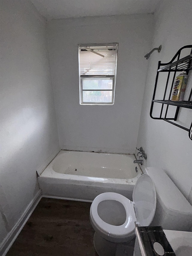 bathroom with toilet and wood-type flooring