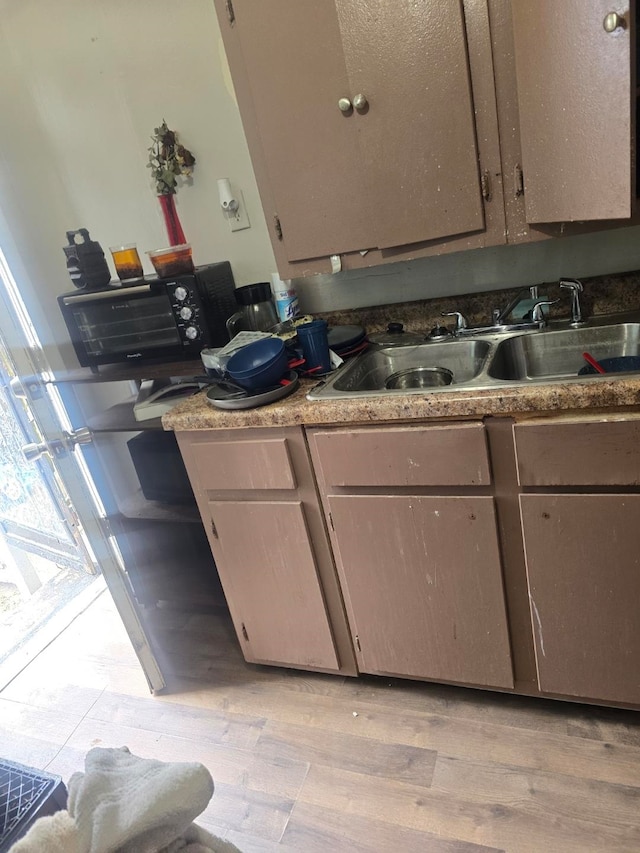 kitchen with sink and light wood-type flooring