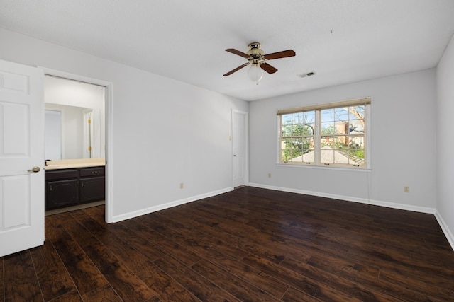 spare room with ceiling fan and dark wood-type flooring