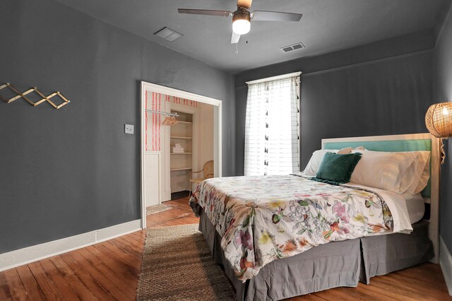 bedroom featuring ceiling fan and hardwood / wood-style floors