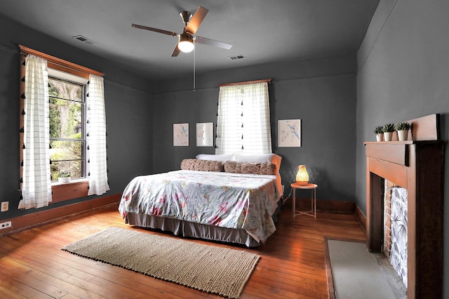 bedroom featuring ceiling fan and hardwood / wood-style flooring