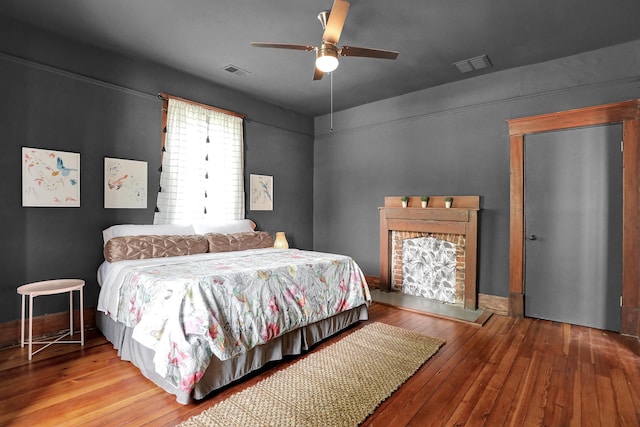 bedroom featuring ceiling fan and hardwood / wood-style flooring