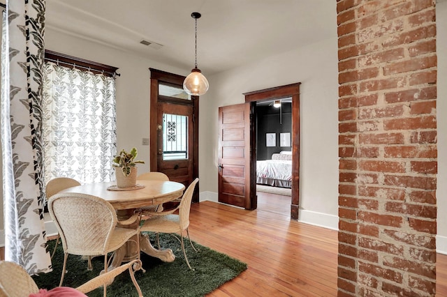 dining space featuring hardwood / wood-style flooring