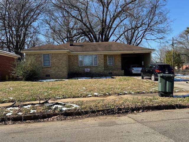 single story home featuring a carport