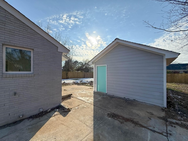 view of side of property featuring an outbuilding