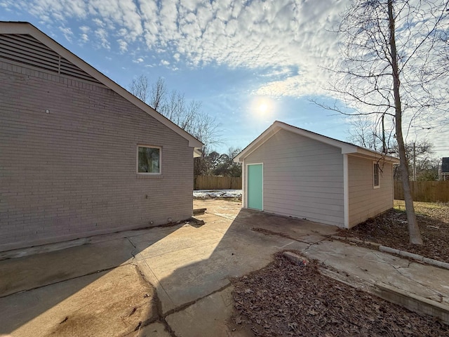 view of side of home with an outdoor structure