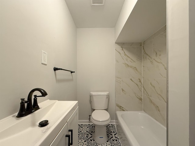 bathroom featuring tile patterned flooring, vanity, and toilet