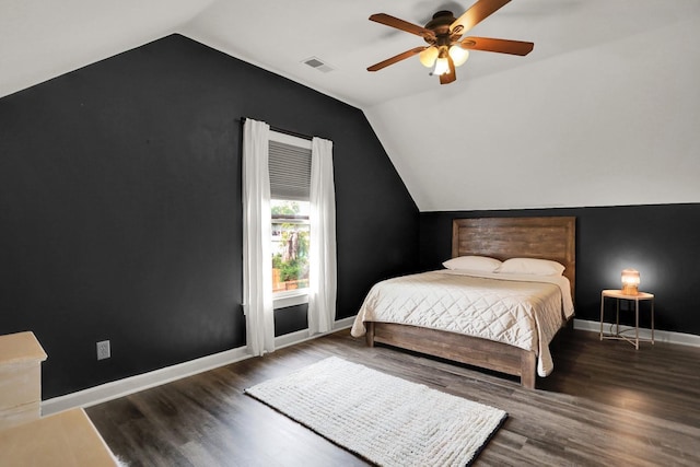 bedroom with lofted ceiling, dark wood-type flooring, and ceiling fan