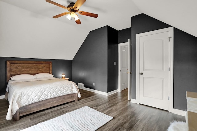 bedroom with vaulted ceiling, ceiling fan, and dark hardwood / wood-style floors