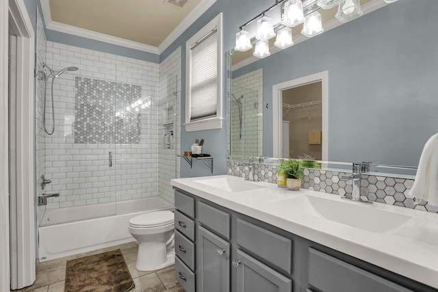 full bathroom with toilet, crown molding, vanity, tile patterned floors, and tasteful backsplash