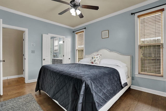 bedroom with dark hardwood / wood-style flooring, ensuite bath, ceiling fan, and ornamental molding