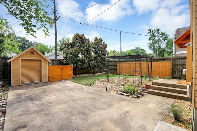 view of patio / terrace with a shed