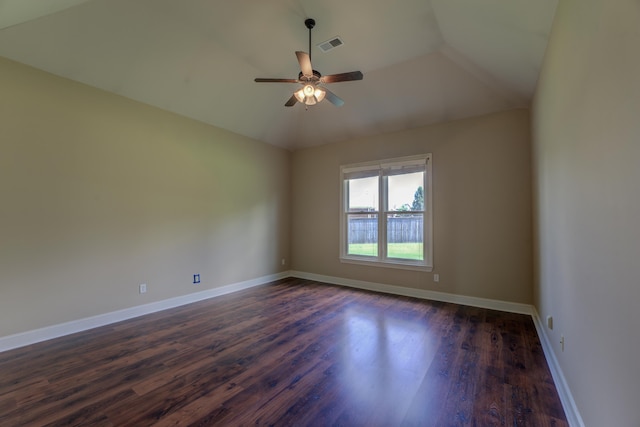 spare room with lofted ceiling, dark hardwood / wood-style flooring, and ceiling fan