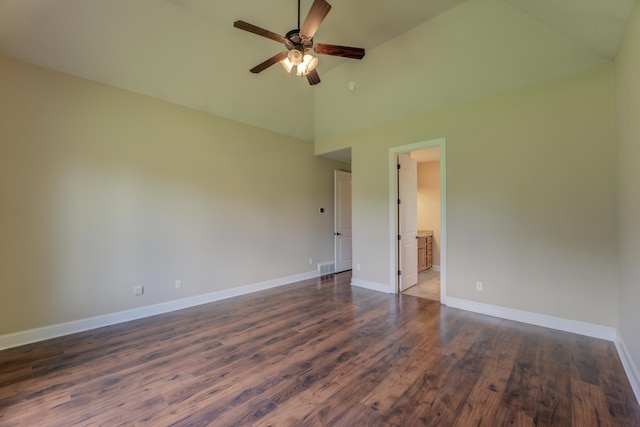 empty room featuring high vaulted ceiling, ceiling fan, and dark hardwood / wood-style flooring